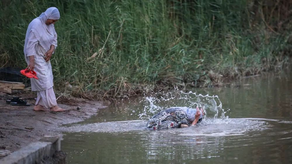 A Mandaean immersing in the Karun River at Ahvaz during masbuta